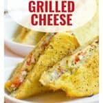 Grilled cheese sandwiches with tomatoes and herbs on a plate, labeled Caprese Grilled Cheese.