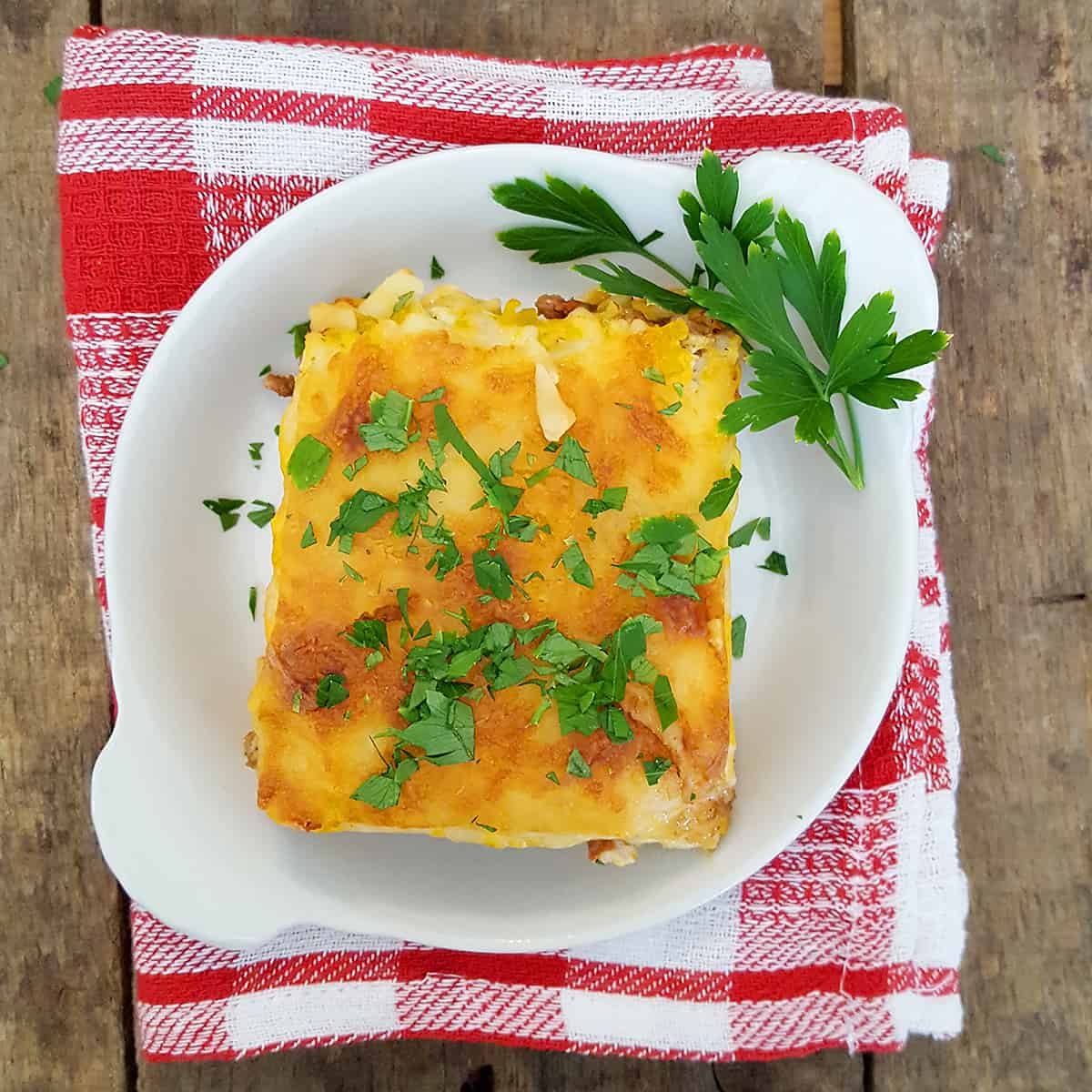 My Egg Noodle Lasagna recipe is a real family pleaser with layers and layers of meat sauce, cheesy filling, and egg noodles. https://www.lanascooking.com/egg-noodle-lasagna/