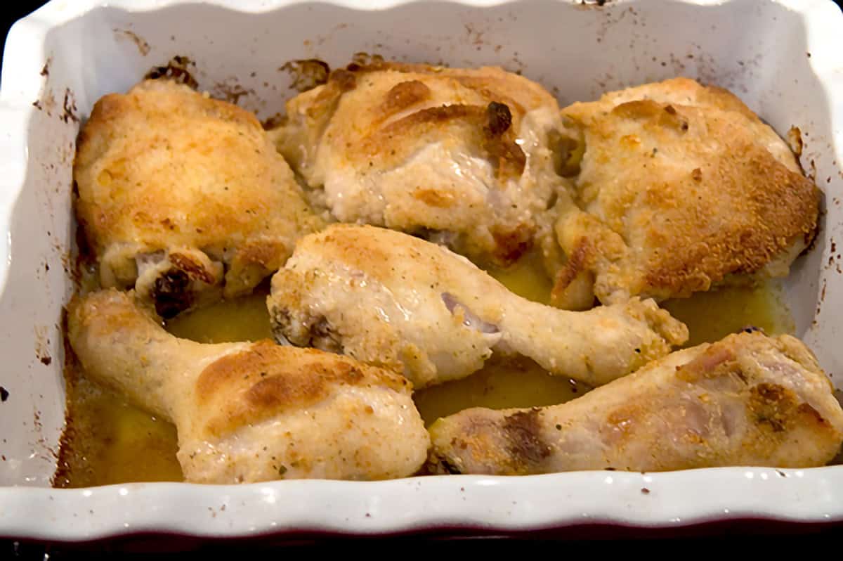Browned chicken pieces in a baking dish.