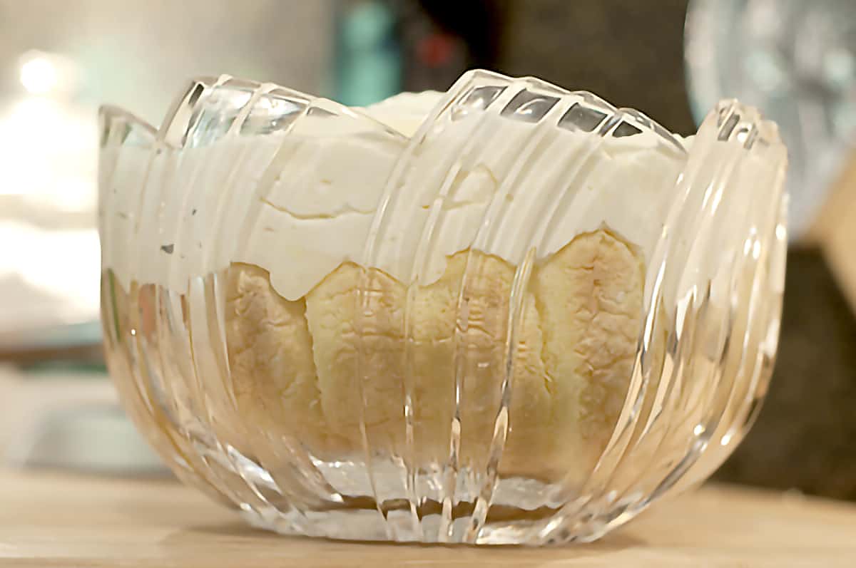 Cut glass bowl lined with ladyfingers and filled with charlotte russe mixture.