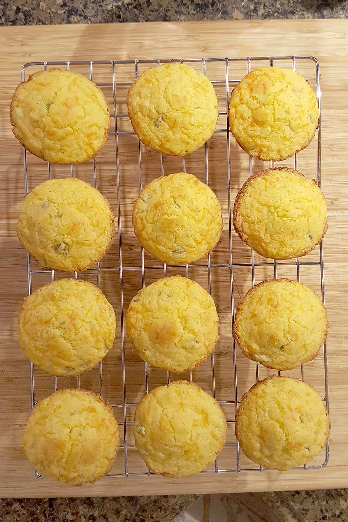 Green Chili Corn Muffins cooling on a wire rack.