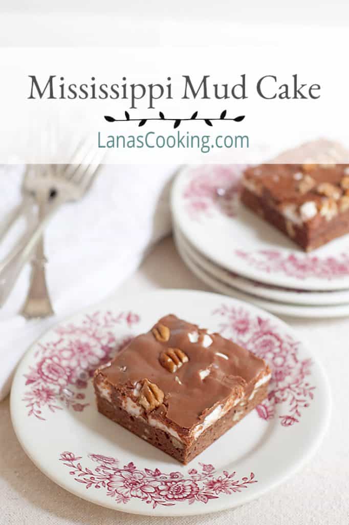 A vintage recipe for Mississippi Mud Cake - a brownie cake base topped with melted marshmallows and drizzled with chocolate frosting. https://www.lanascooking.com/mississippi-mud-cake/