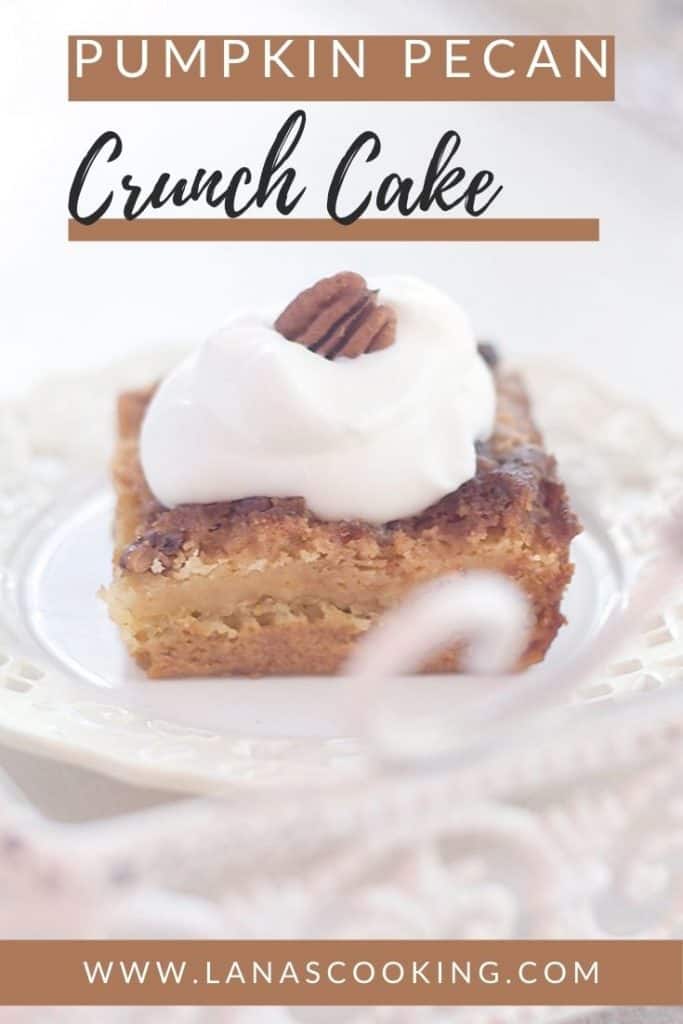 A slice of pumpkin crunch cake on a white serving plate with text overlay for pinning.