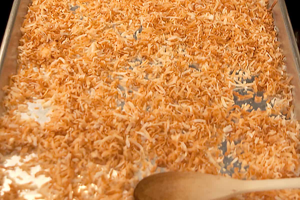 Toasted coconut on a baking sheet.