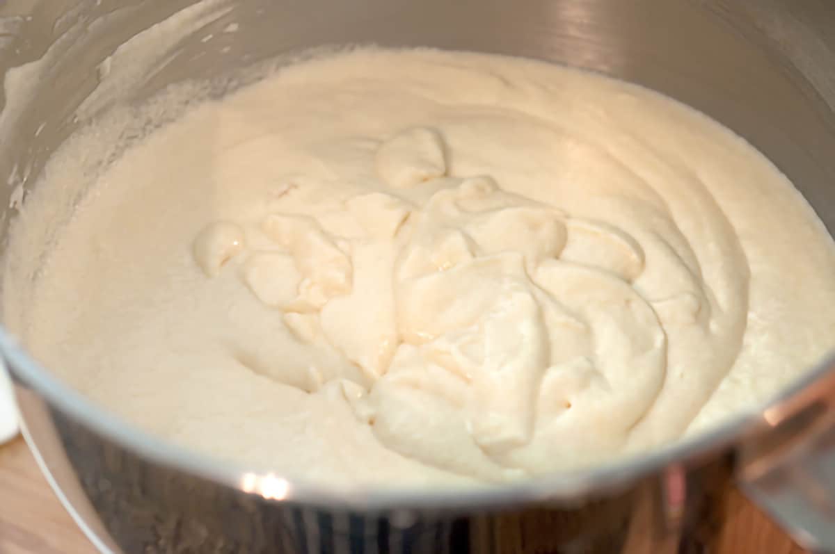 Batter for the cake layers in a mixing bowl.