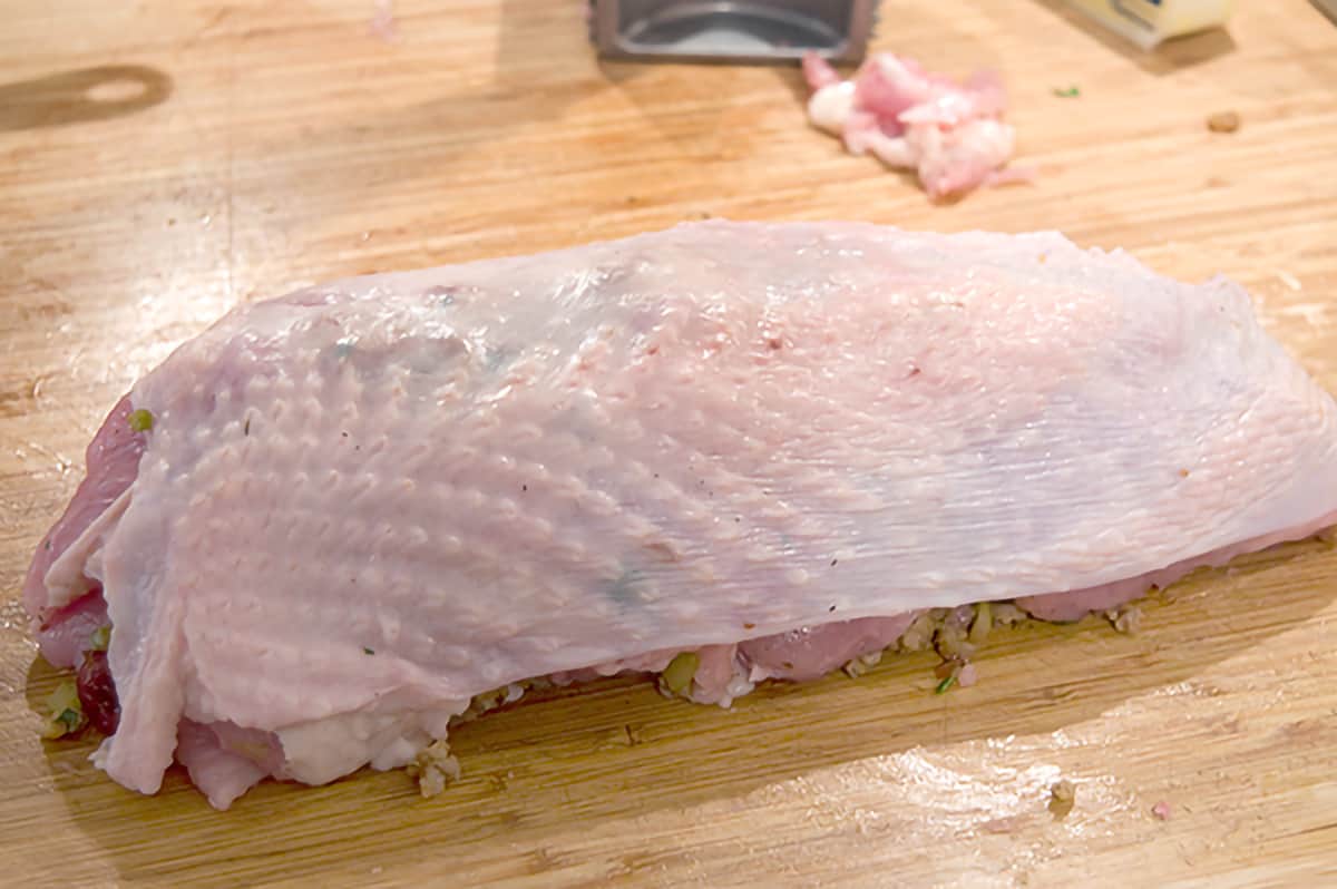 Rolled turkey breast with skin over the top.