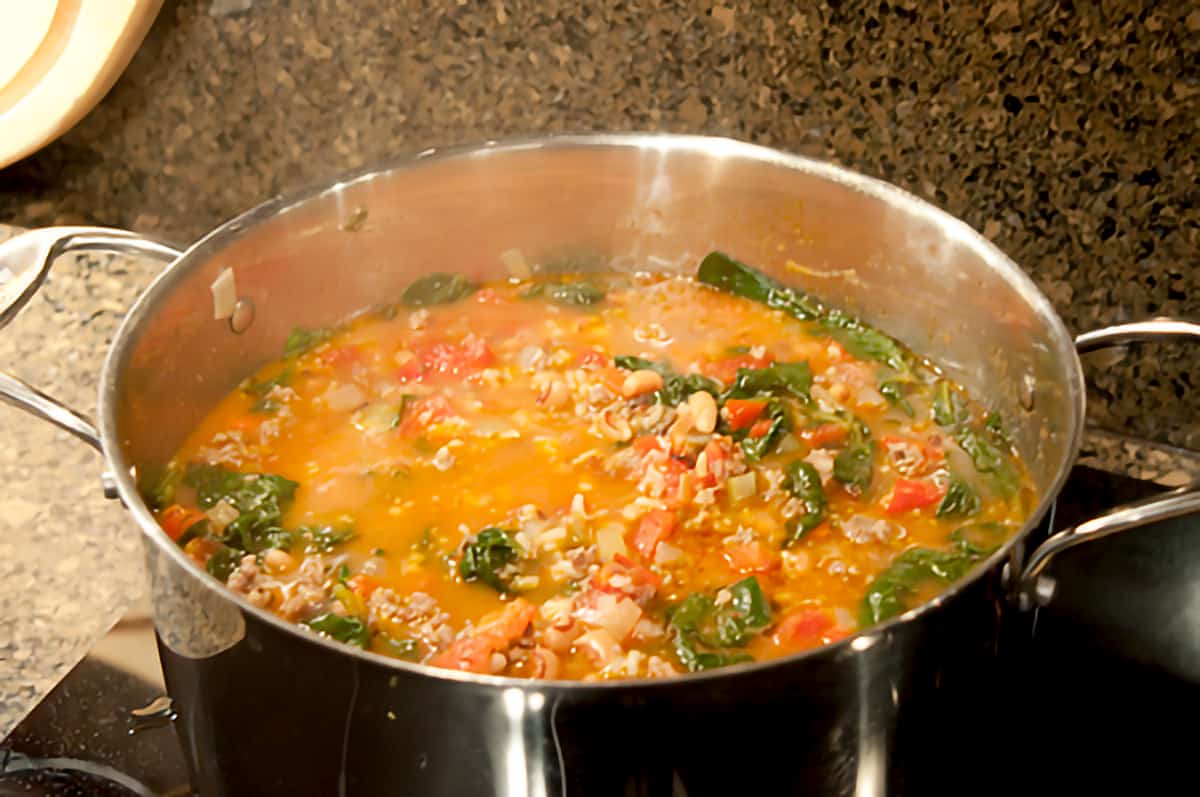Finished soup with spinach added to the pot.