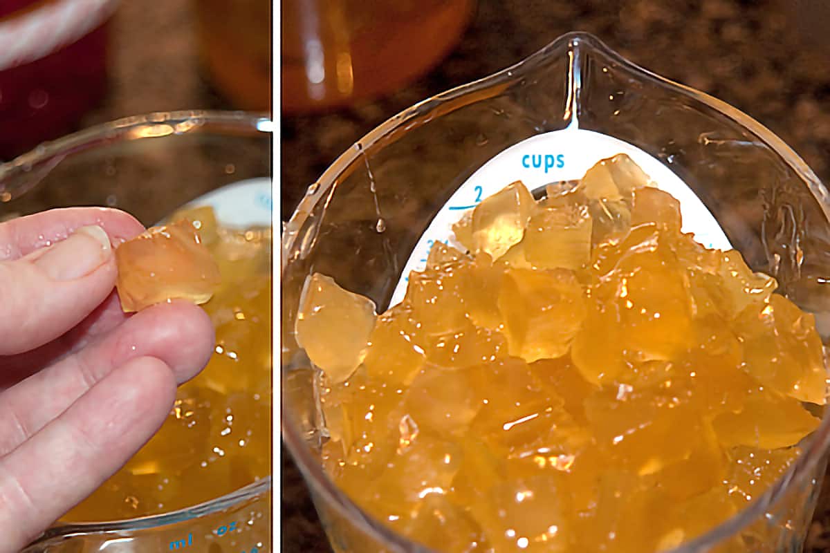 Chopped candied pineapple in a measuring cup.