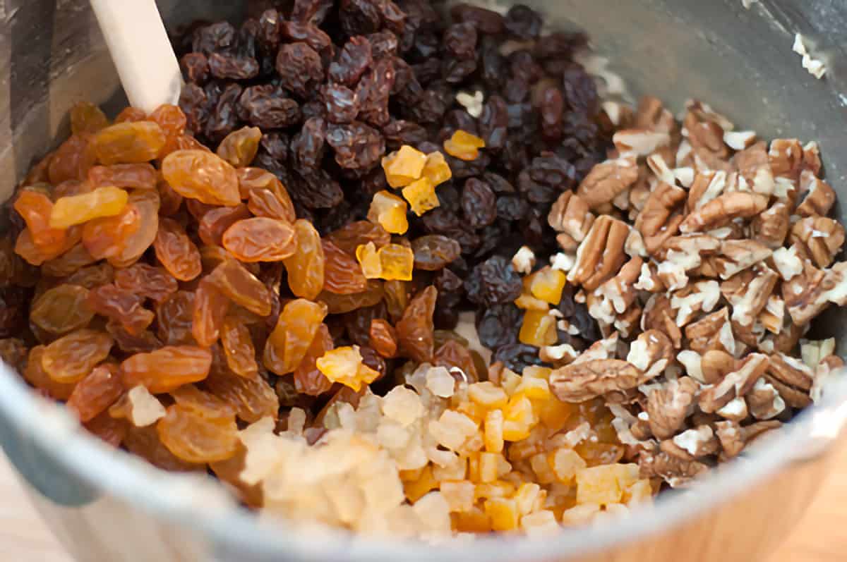 Nut and fruit mixture added to mixing bowl.