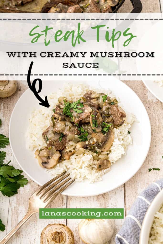 Steak tips with Creamy Mushroom Sauce over rice on a serving plate.
