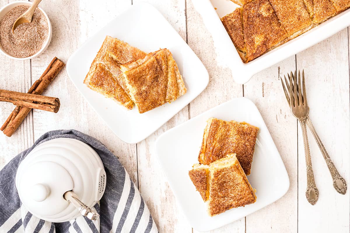 Several servings of Cream Cheese Filled Crescent Roll Pastries on serving plates.