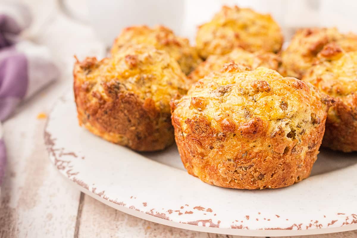 Serving plate with several finished sausage muffins