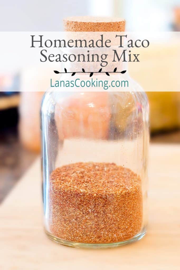 Glass jar filled with homemade taco seasoning mix.