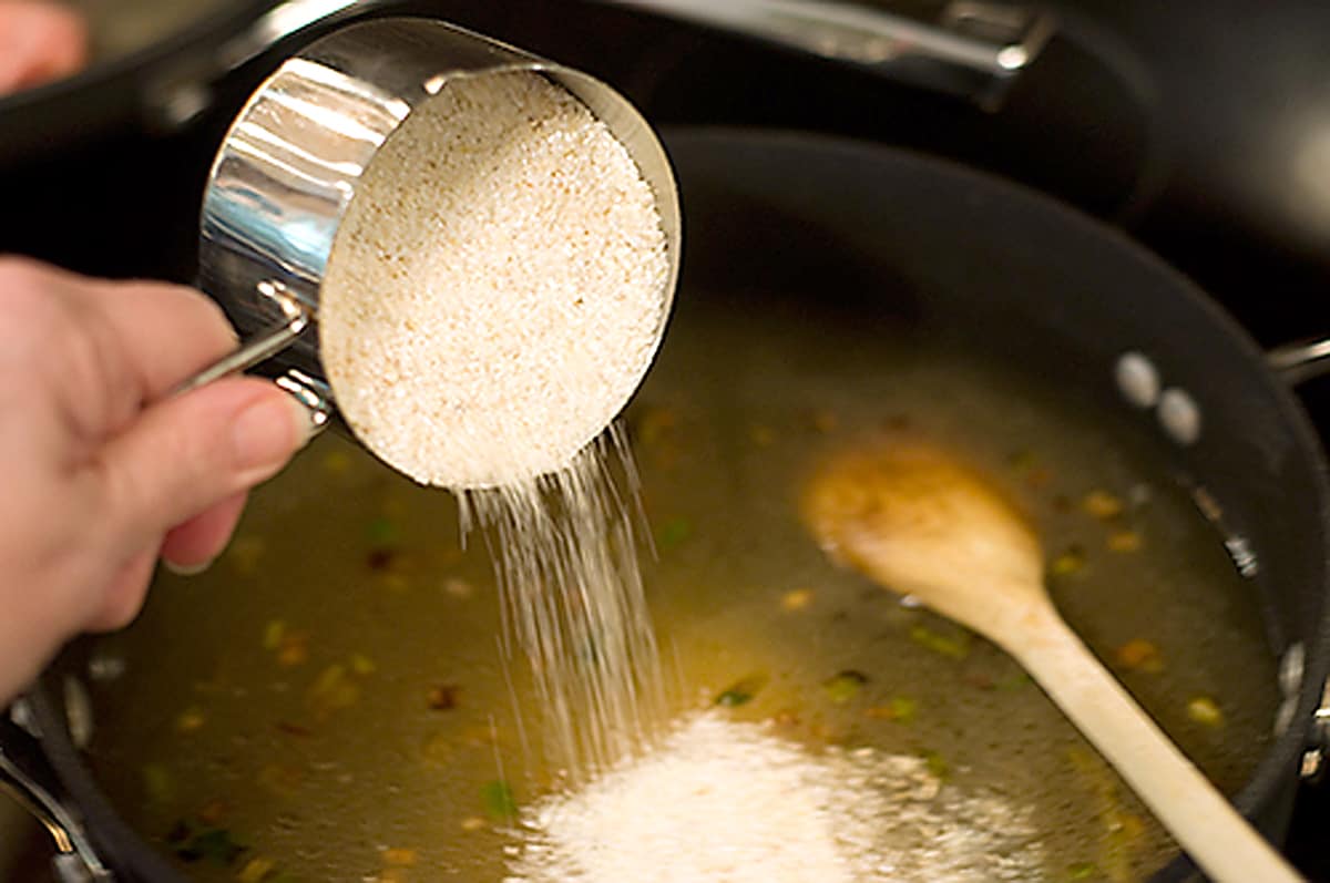 Adding grits and remaining ingredients in a skillet.