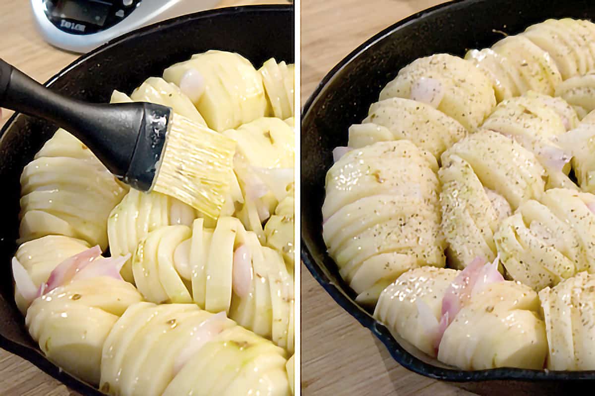 Potatoes and shallots in a cast iron skillet brushed with butter and sprinkled with salt and pepper.