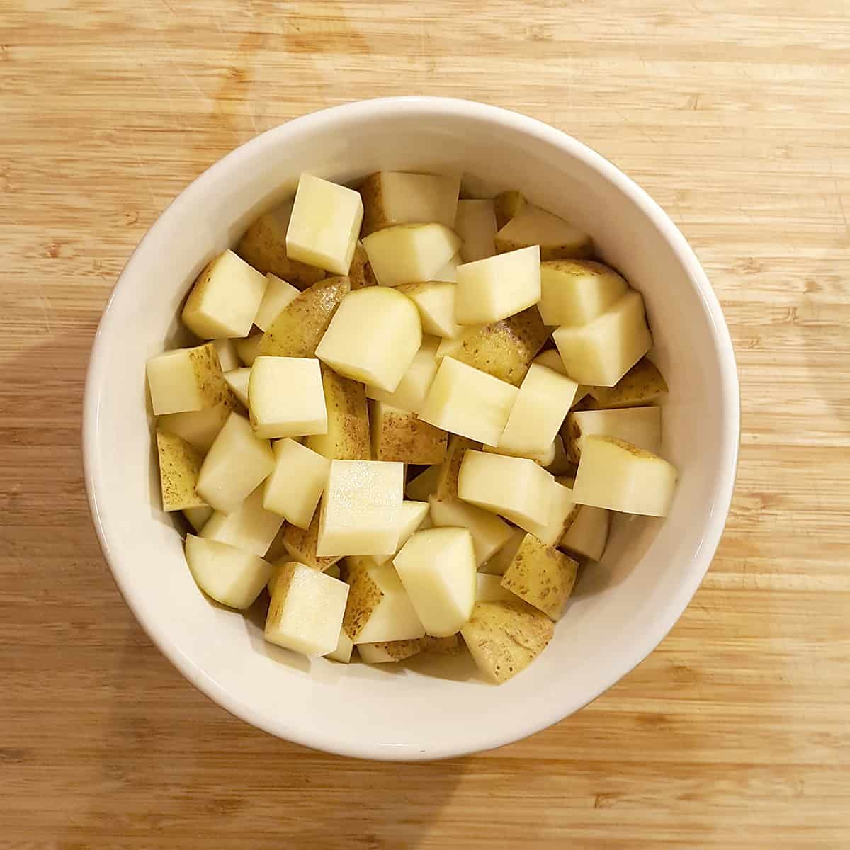 Cubed potatoes in a bowl.