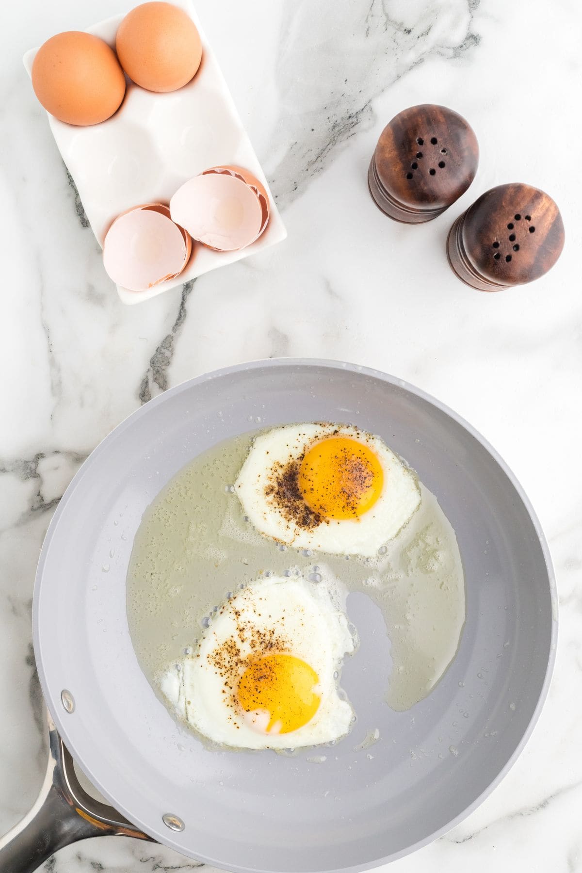 Eggs after being cooked over-easy in a non-stick skillet.
