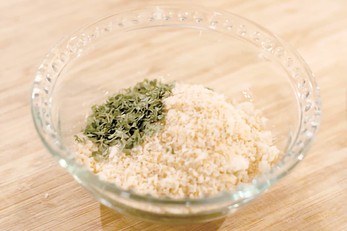 Small bowl with breadcrumbs, parsley, and garlic.