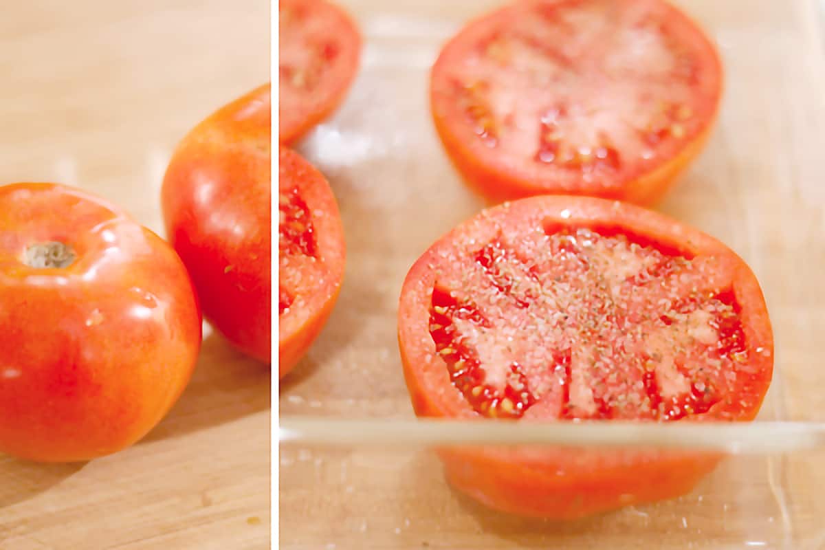 Halved tomatoes sprinkled with salt and pepper in a baking dish.