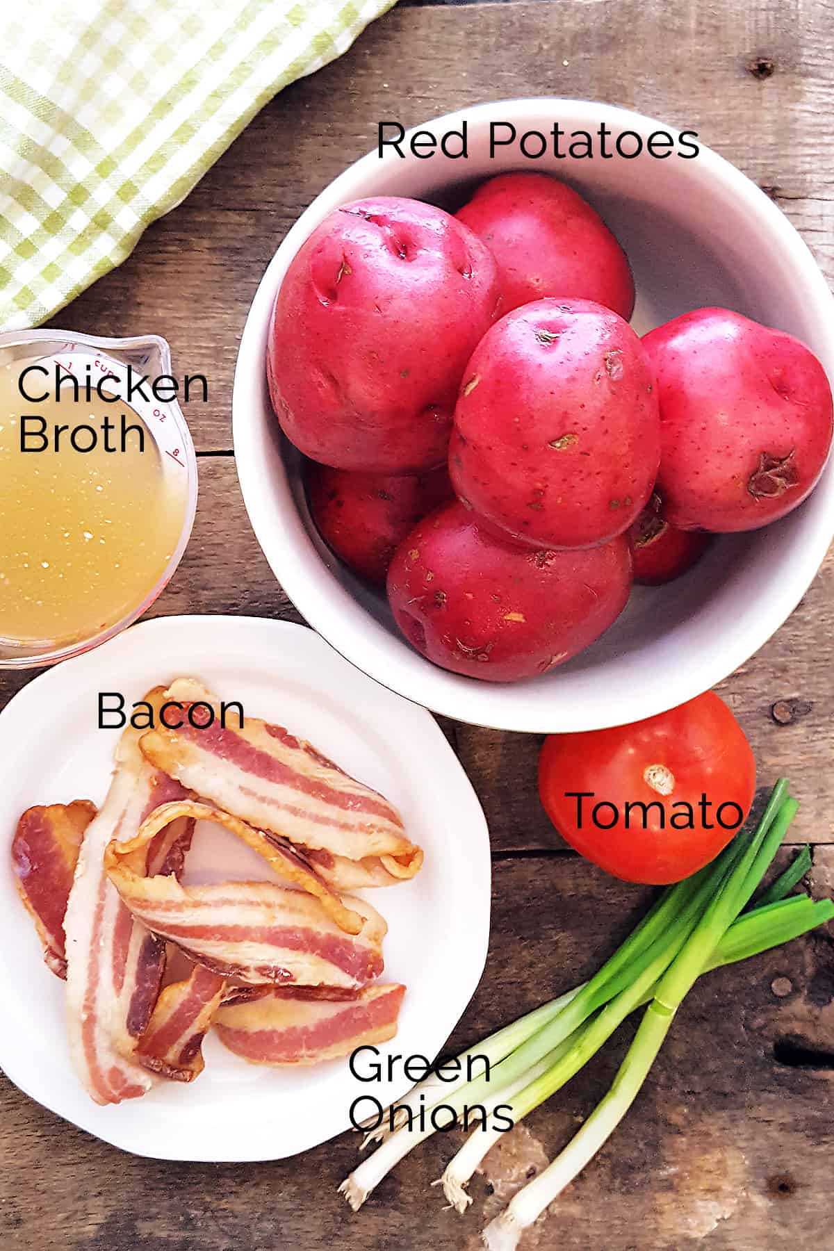 Ingredients needed for the recipe: chicken broth, red potatoes, tomato, green onions, bacon