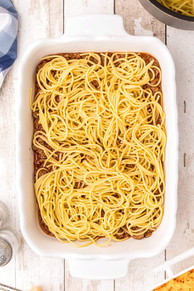 Second layer, spaghetti noodles, in casserole dish.