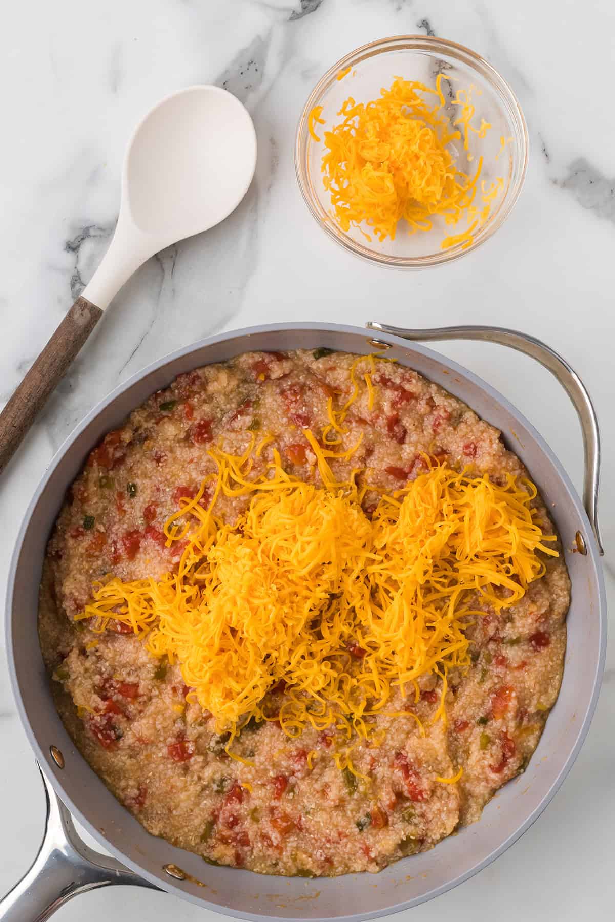 Four ounces of cheese added to the grits mixture.