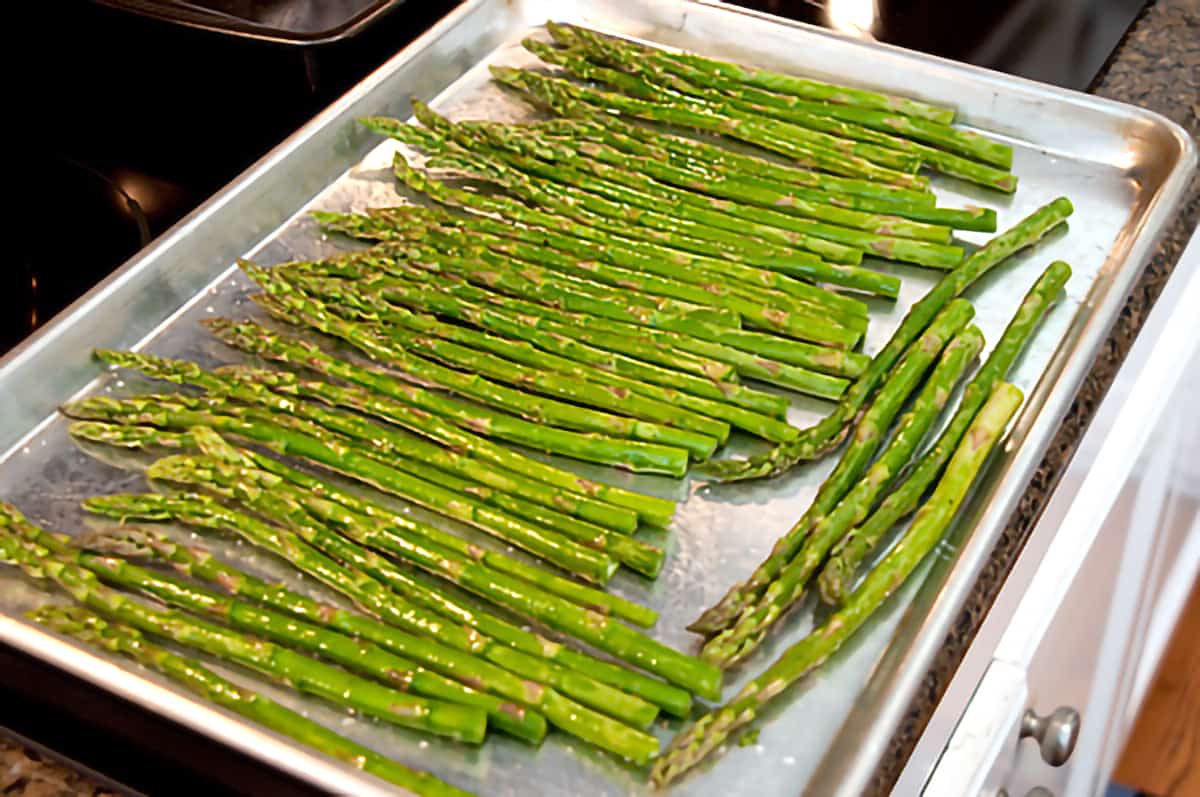 Asparagus on a baking sheet.