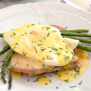 Country eggs benedict on a white serving plate.