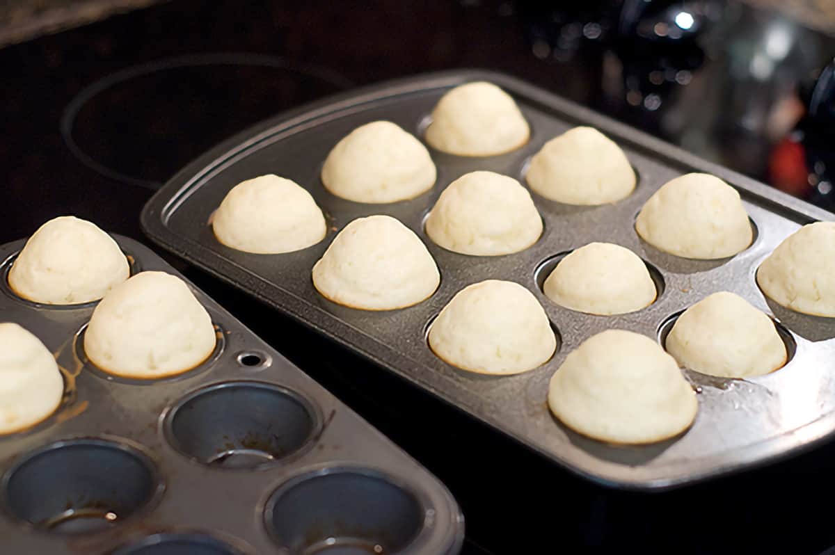 Mini muffin tins with baked muffins.