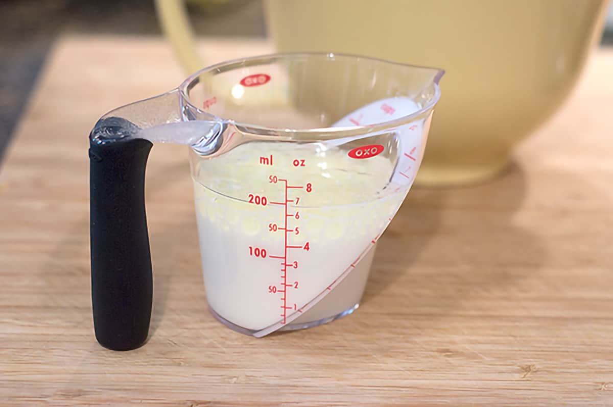 Measuring cup containing wet ingredients for the recipes.