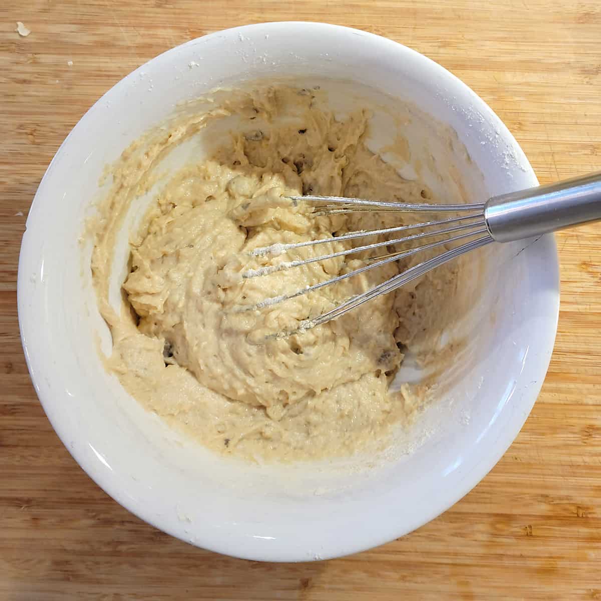 Butter, soup, and flour whisked together in a mixing bowl.
