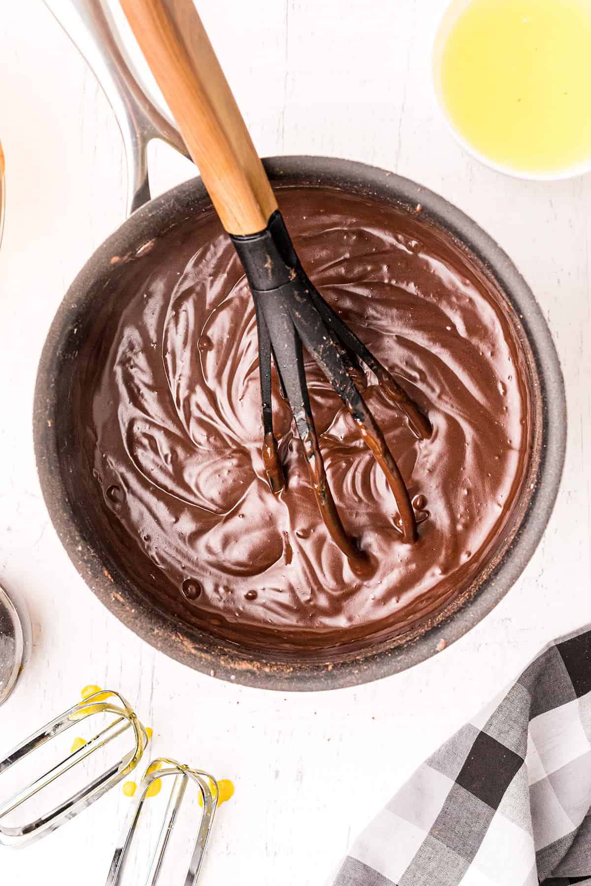 Adding egg mixture back to the cocoa mixture.