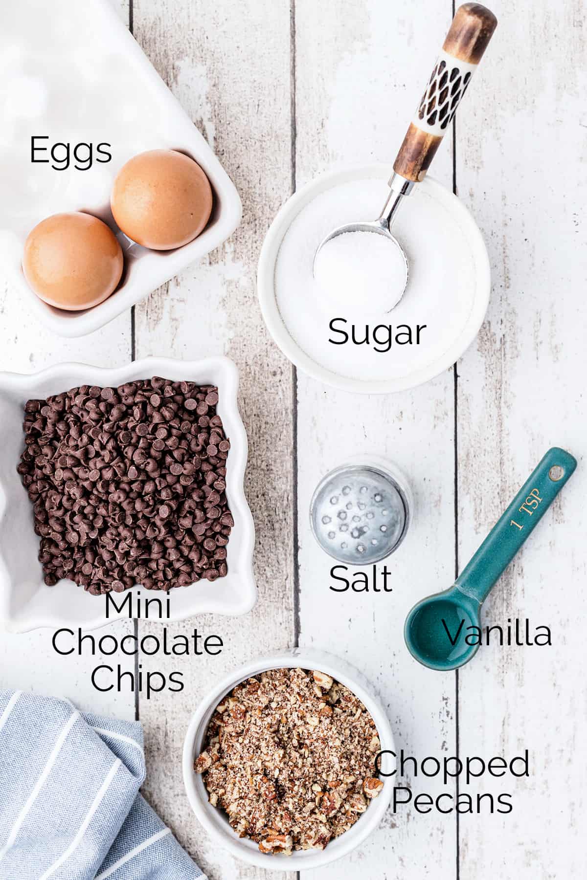 Ingredients needed for the recipe: eggs, sugar, salt, vanilla, chocolate chips, pecans