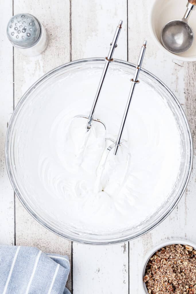 Egg whites in mixing bowl beaten until stiff.