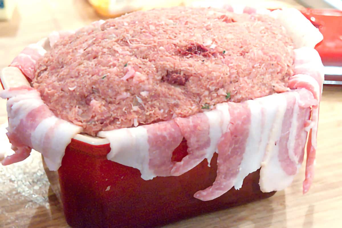 Terrine pan filled with meat mixture.