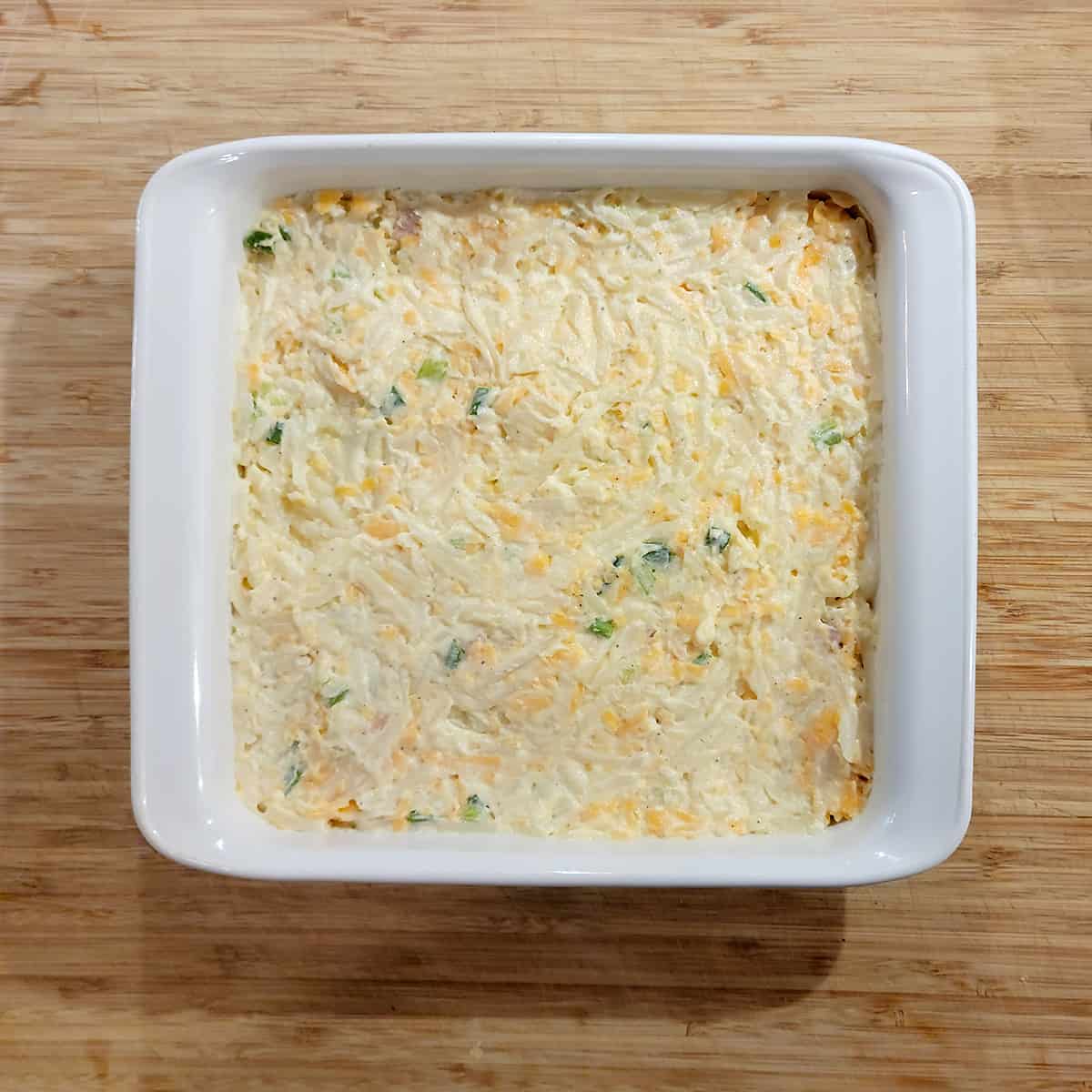 Potato mixture in the prepared baking dish.