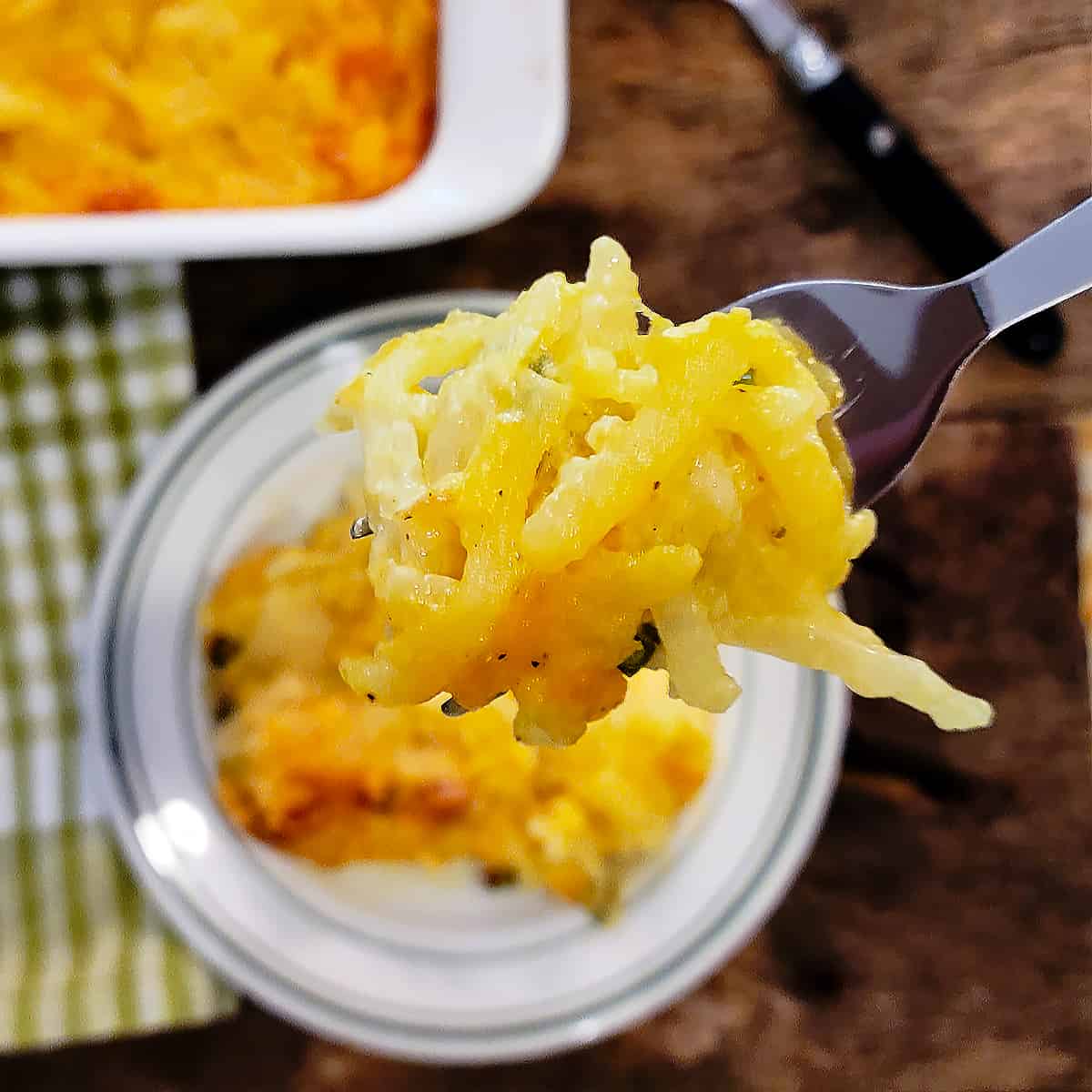 A forkful of hash brown casserole.