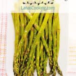 Oven roasted asparagus on a white serving dish.