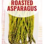 A plate of oven-roasted asparagus with text overlay reading Oven Roasted Asparagus.