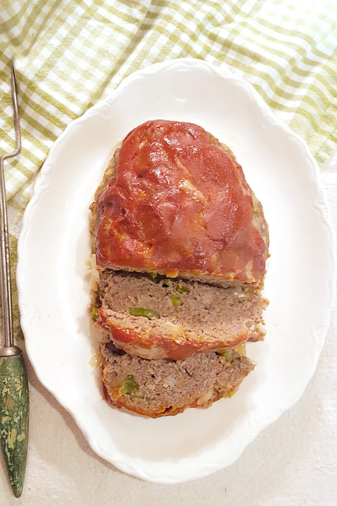 Southern meatloaf on a white serving plate.