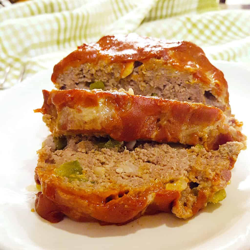 Southern meatloaf on a white serving plate.