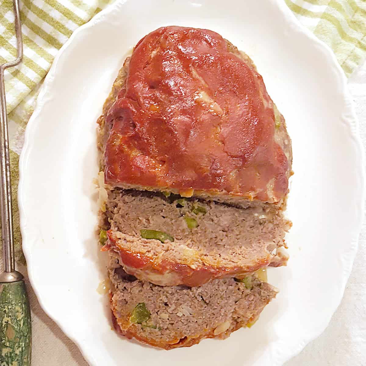 Southern meatloaf on a white serving plate.