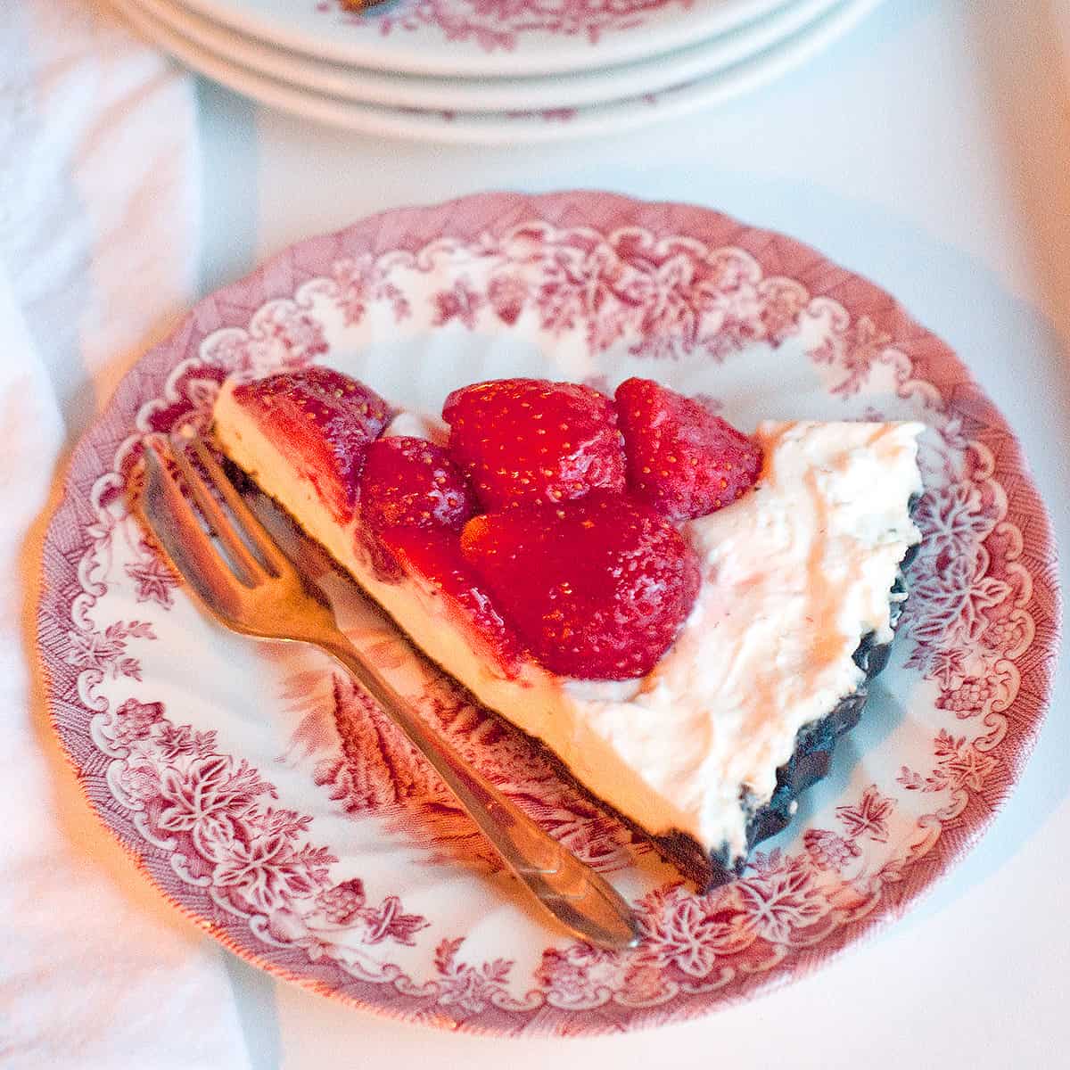 Strawberry pie on a decorative vintage plate.