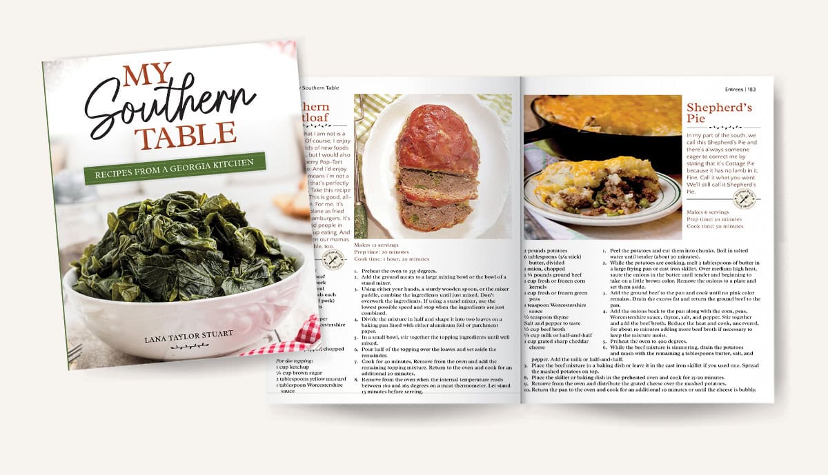 A cookbook cover with greens and open pages showing meatloaf and shepherd’s pie recipes with photos.
