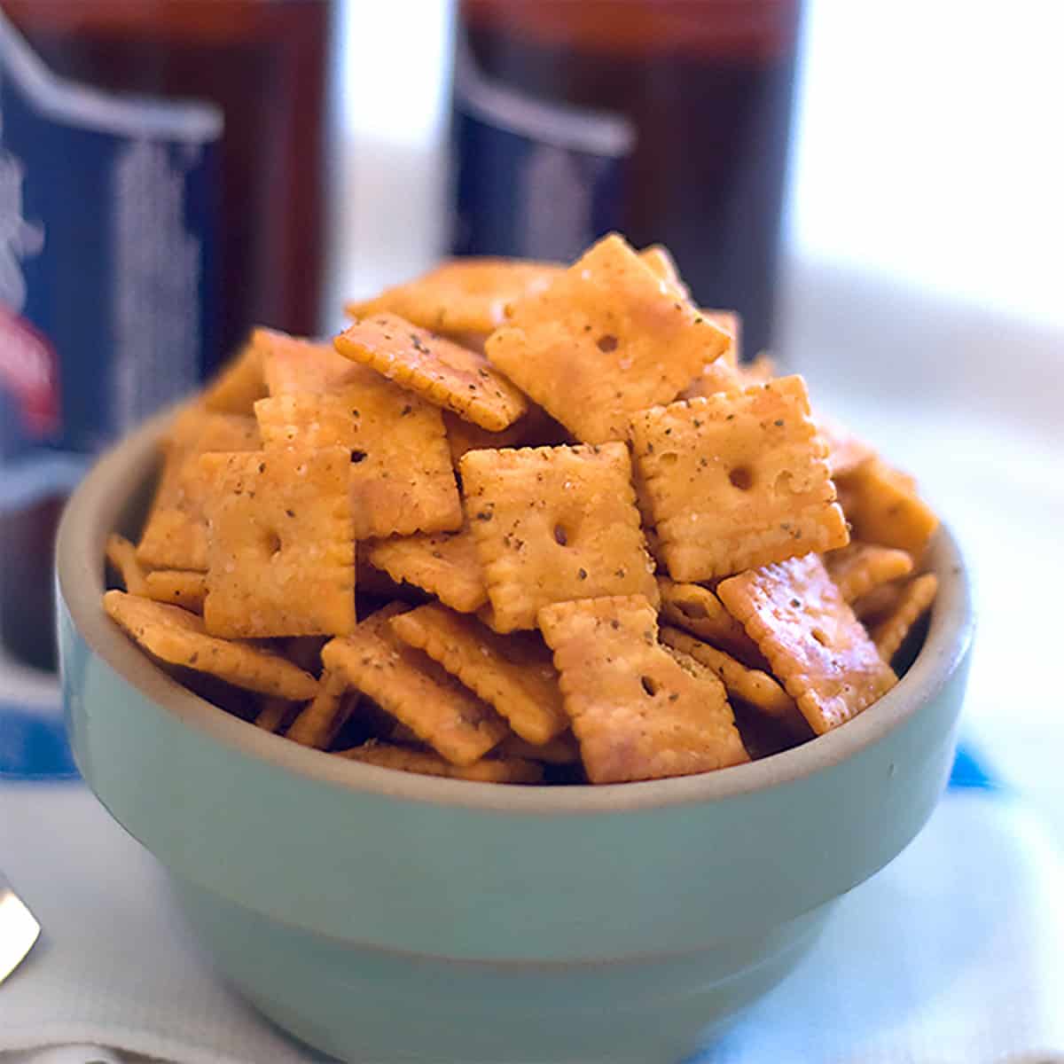Spicy cheese crackers in a green vintage bowl.