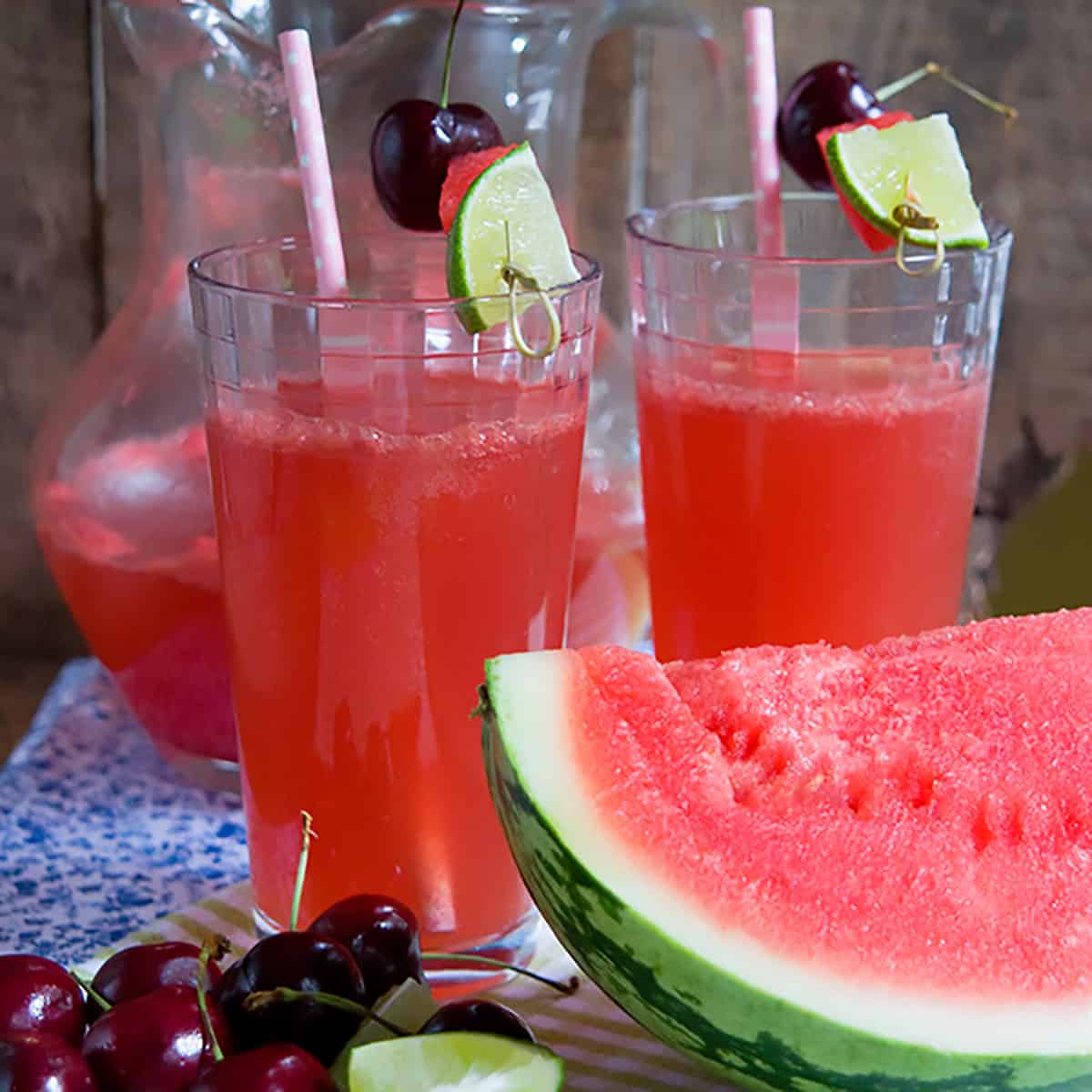 Two glasses of watermelon cherry limeade.