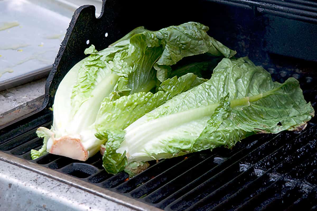 Romaine lettuce cooking on the grill.