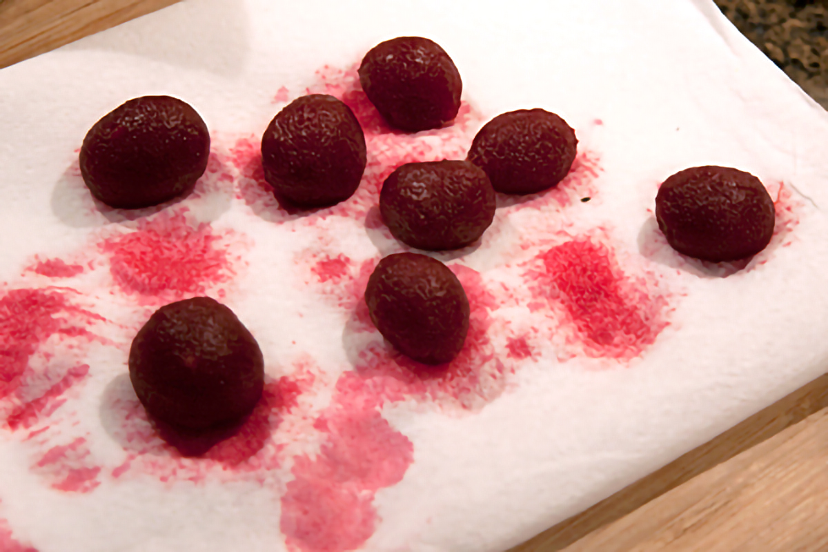 Draining pickled baby beets on paper towels.