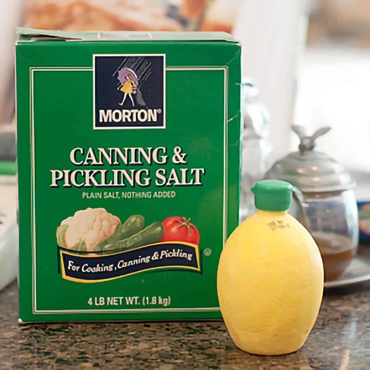 A box of pickling salt and bottled lemon juice.