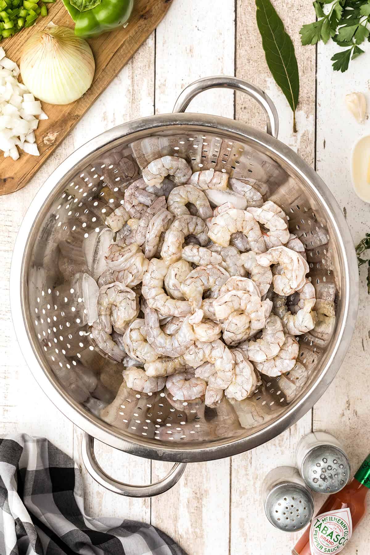 Fresh shrimp draining in a colander.